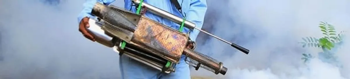 Fumigation technician using a fogger for deep pest treatment in Tuscaloosa, AL